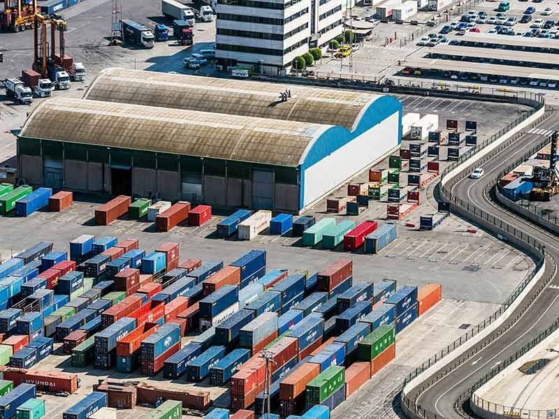 Aerial view of Containers and warehouse in Port De Barcelona (Catalonia), Spain.