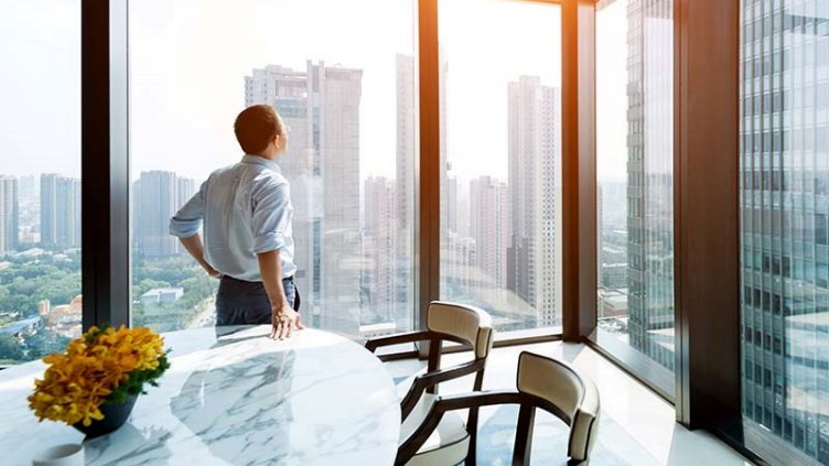 A man looking out the window