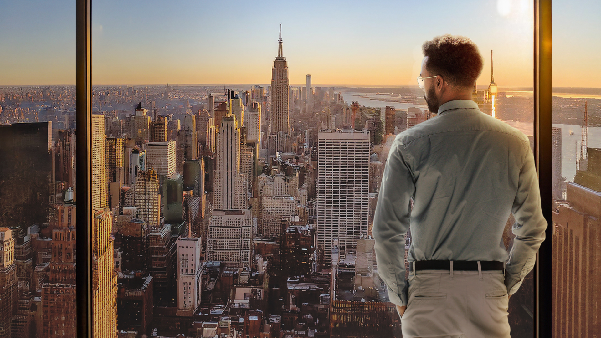 A person looks at the tall buildings