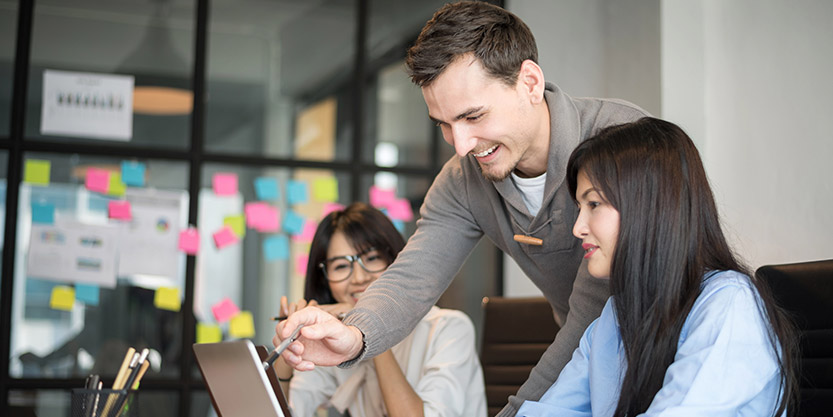 A small team discussing in office