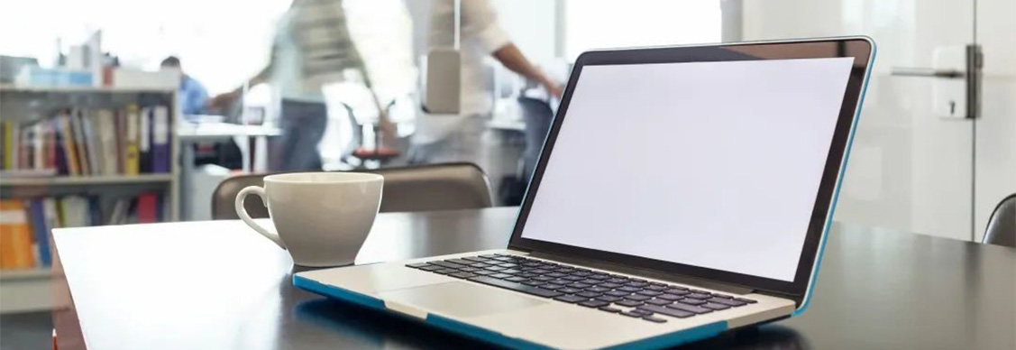laptop with a cup of coffee