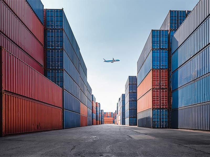 Containers with a Aeroplan at background