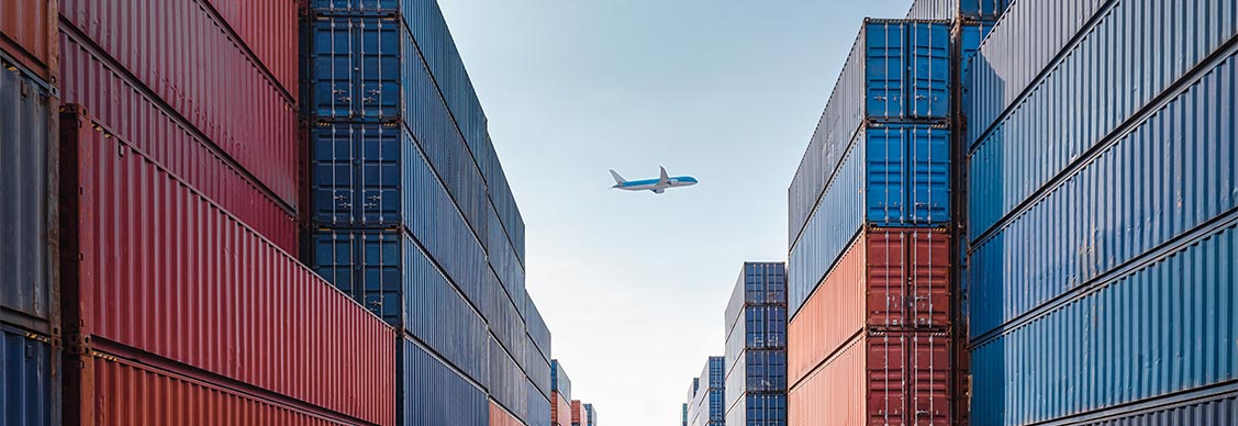 Containers with a Aeroplan at background