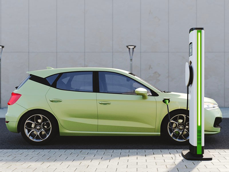 An electric vehicle at a charging station in the city