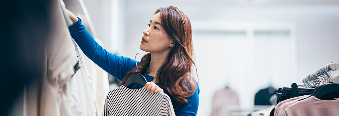 a woman buying clothes