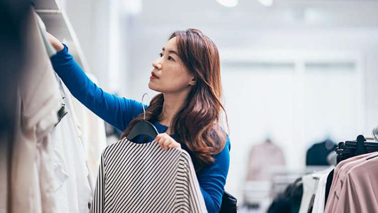 a woman buying clothes