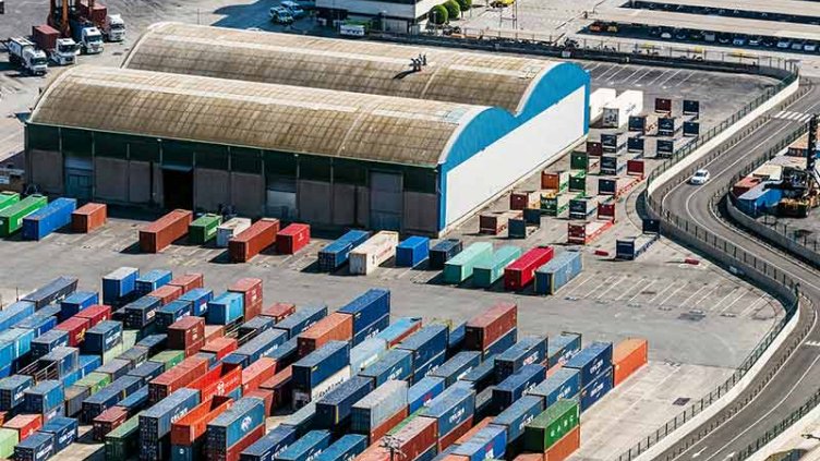Aerial view of Containers and warehouse in Port De Barcelona (Catalonia), Spain.