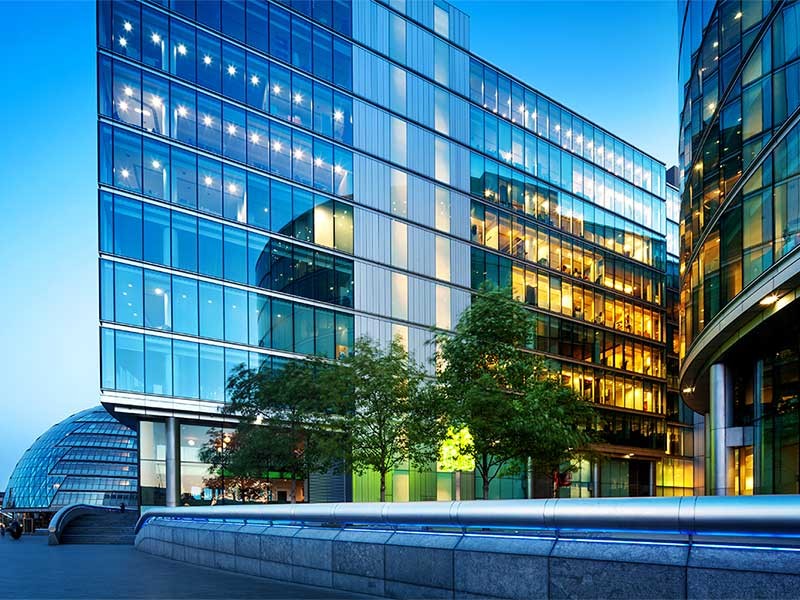 Illuminated Office Buildings at Night in London