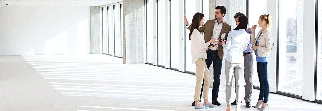 Employees chatting at corridor 