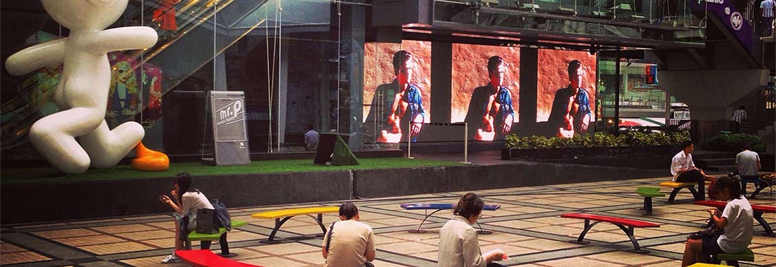 People sitting outside shopping mall