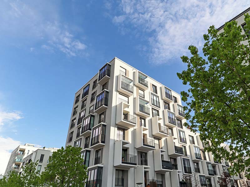 Cityscape of a residential area with modern apartment buildings, new green urban landscape in the city.