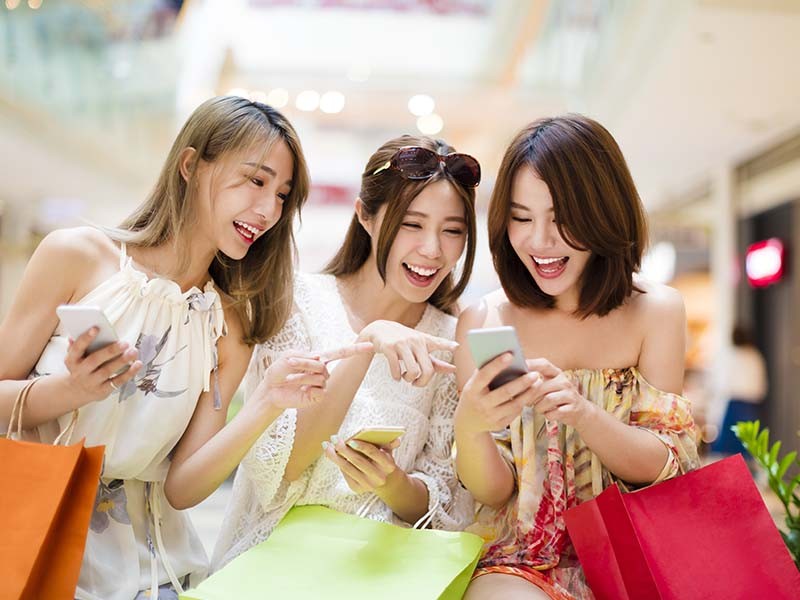 girls browsing through phone