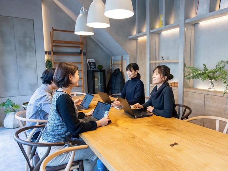 Young business people working in green office