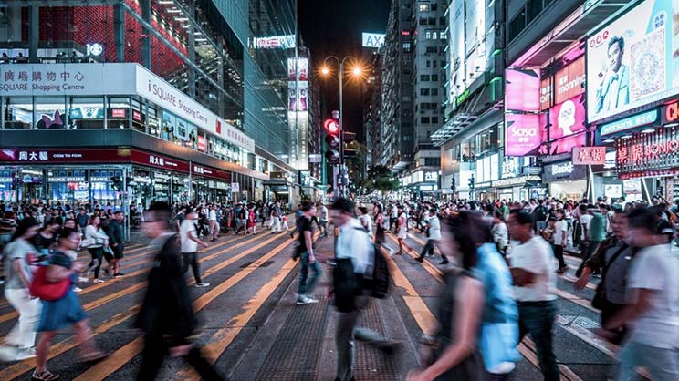 Blur image of people crossing road