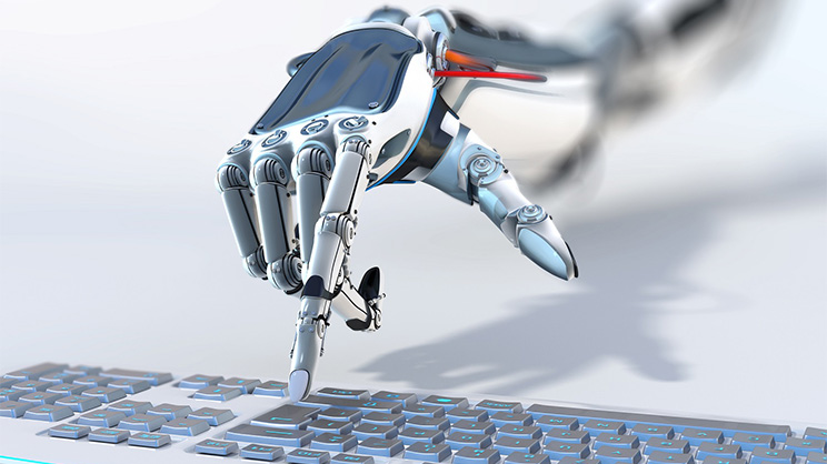 Robotic hand on keyboard