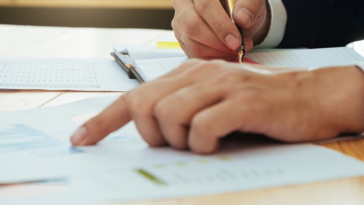 Man signing some documents