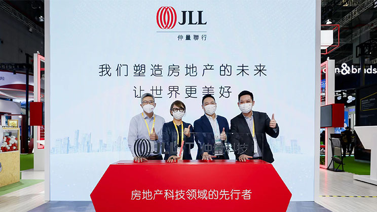 Group picture with JLL promotion Board