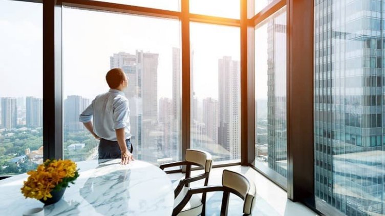 A man looking outside the office