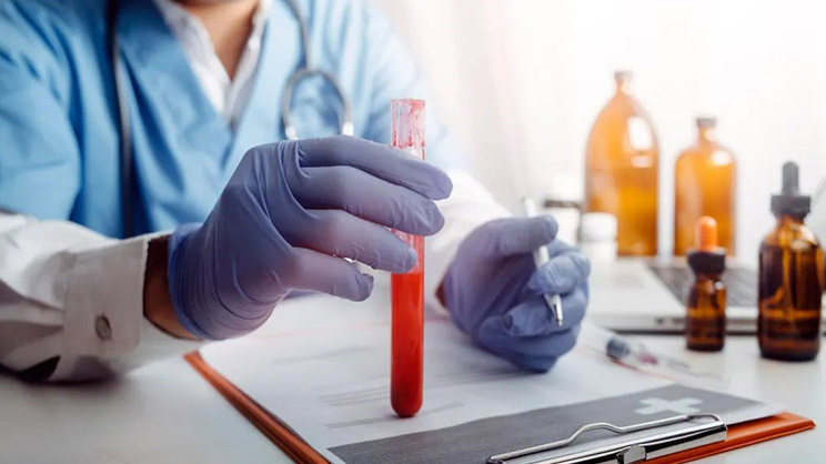 lab technician holding a test tube