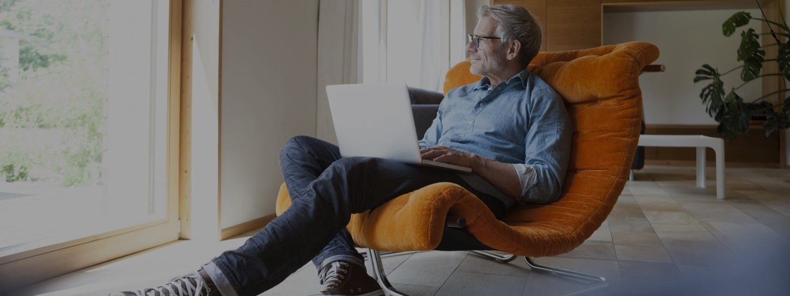 man sitting on sofa