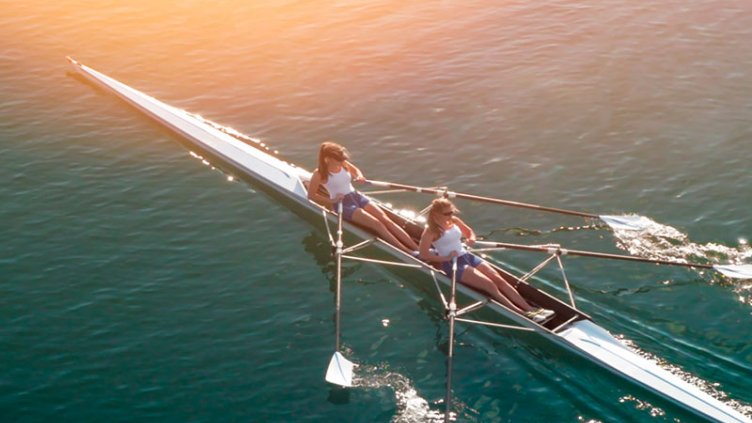 Two girls rowing