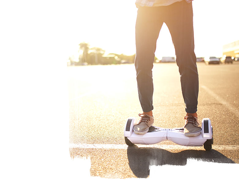 Young man riding on the hoverboard