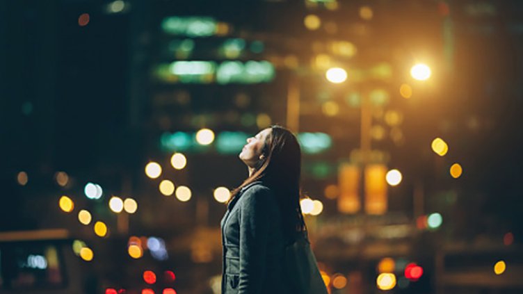 Women enjoying the night lights in the city