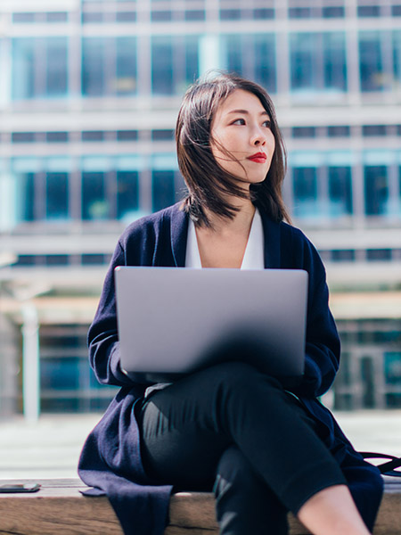 Young girl working on laptop