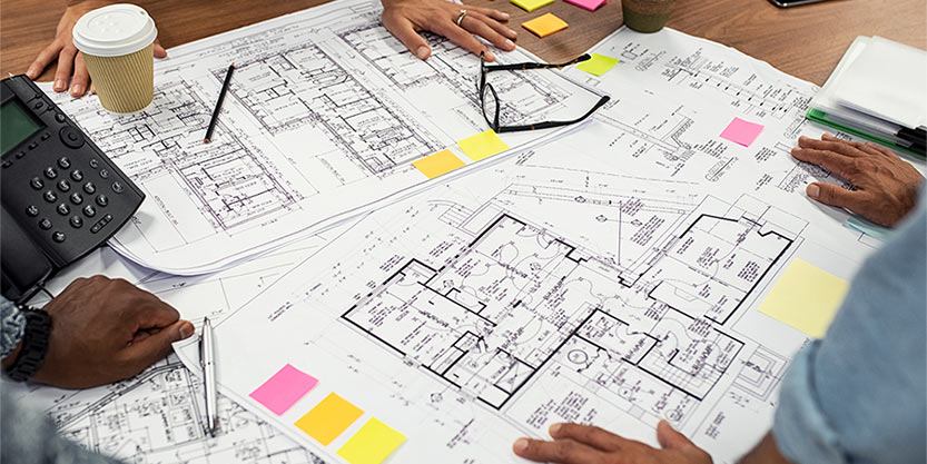 People discussing with floor plan