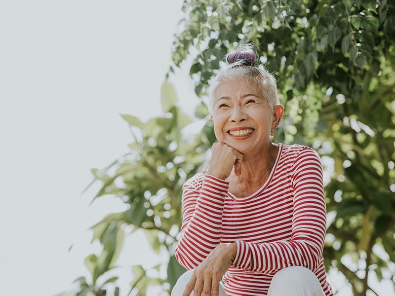 Portrait of smiling Asian senior woman