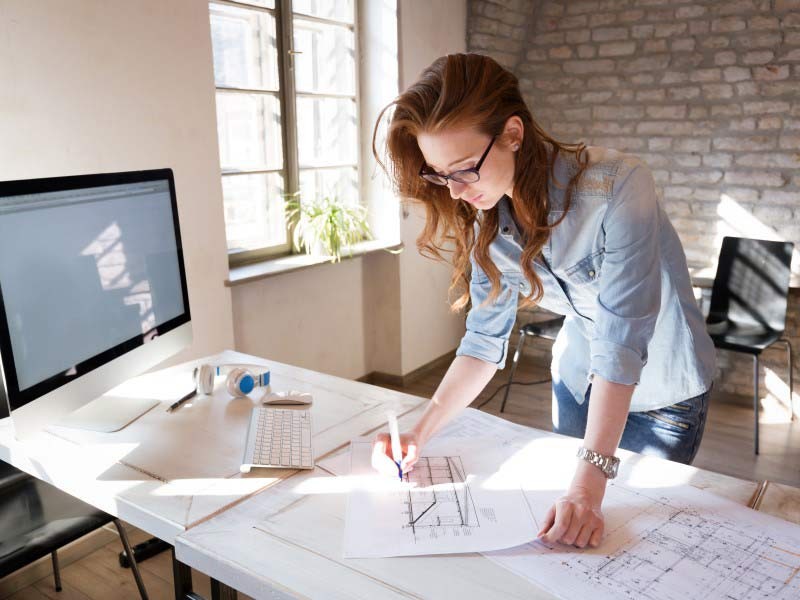 A woman working inside the office