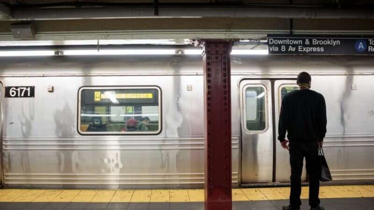 Office worker waiting for metro