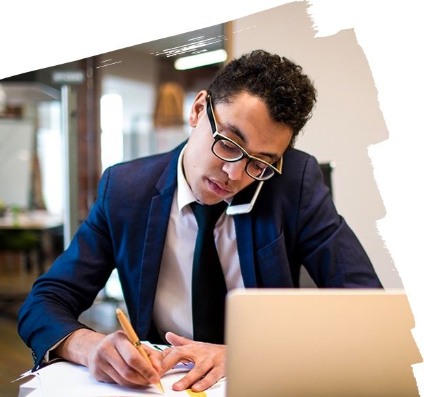 Employee working on data charts and communicating over phone