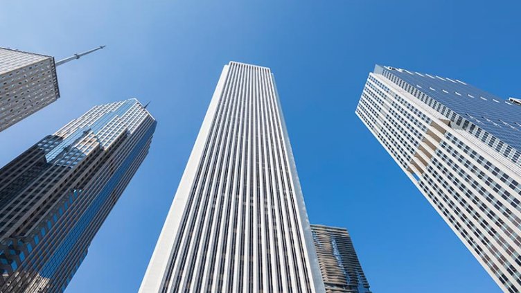 Multiple buildings are in low angle view