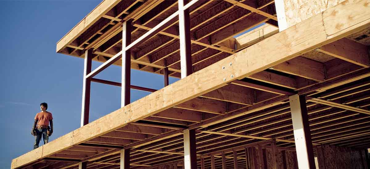 Man standing on house