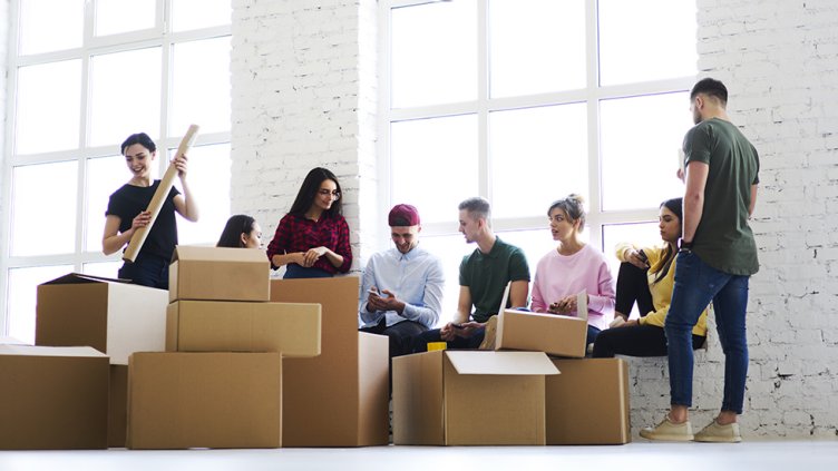 workers unpack moving boxes