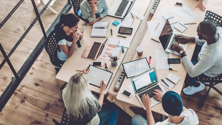 employees working in Meeting room over some project